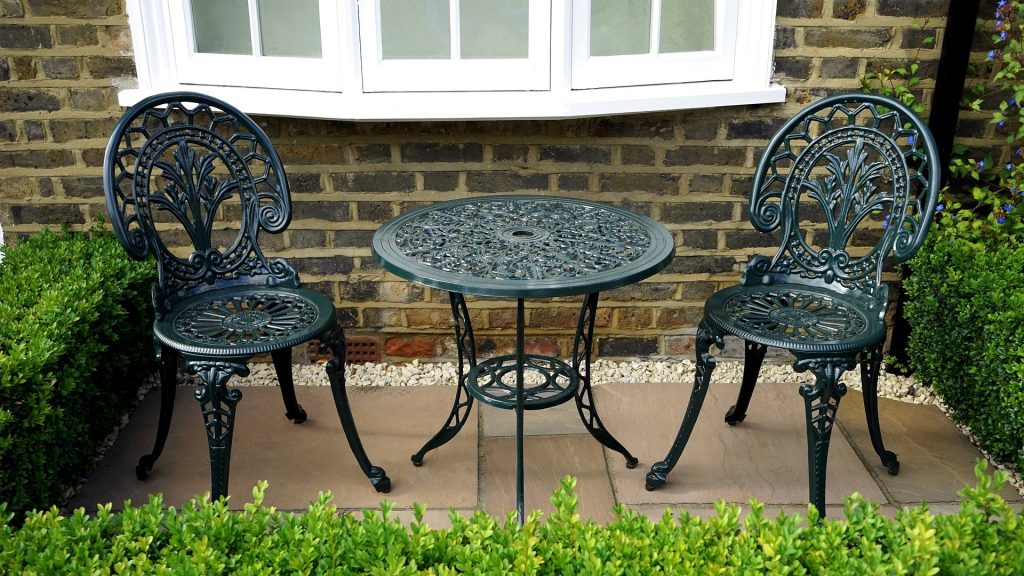 Cast Iron decorative garden furniture and box hedging